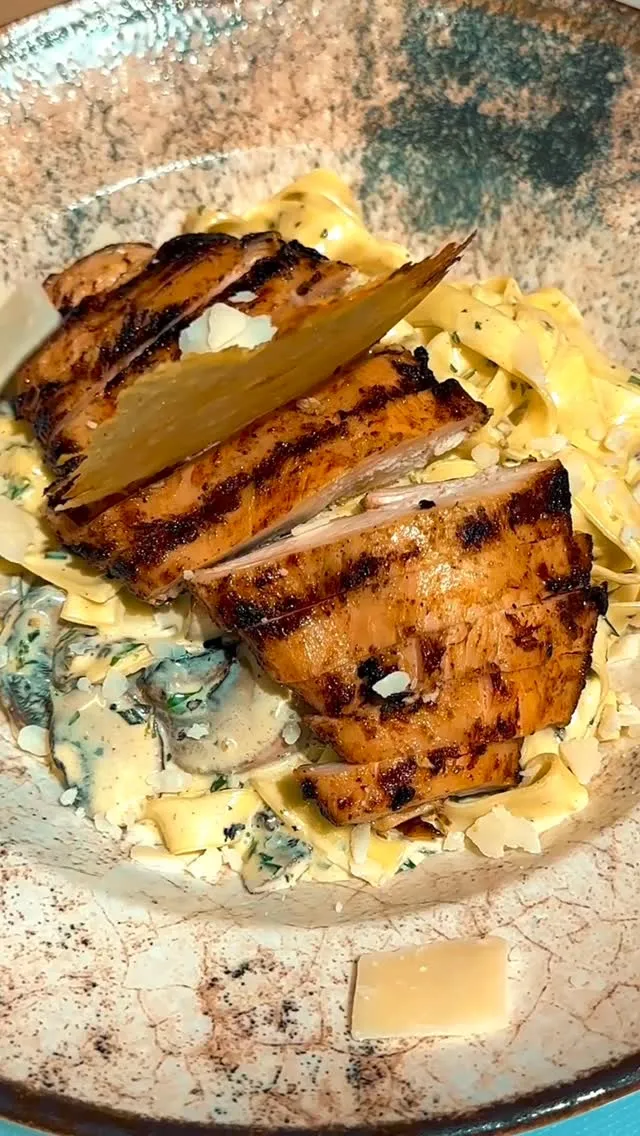 Mushroom tagliatelle topped with grilled chicken
